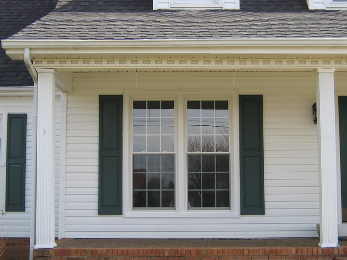 white siding, window with shutter